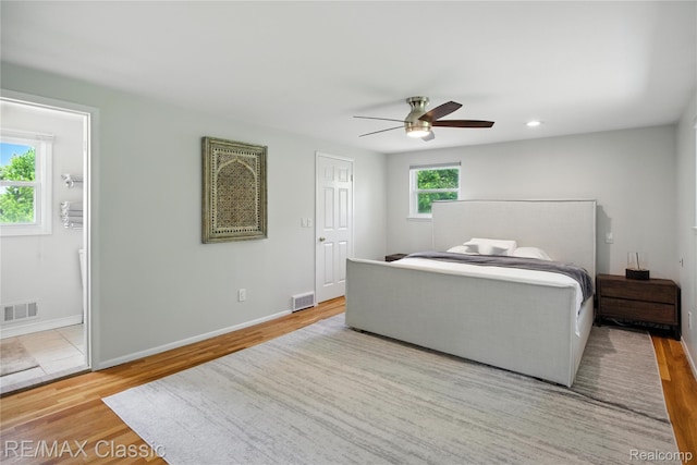 7027 Beverly Crest Dr, West Bloomfield, MI 48322 - bedroom featuring wood finished floors, ceiling fan, and ensuite bath