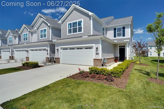 606 Angus Ln, Saline, MI 48176 - view of front of property featuring an attached garage, brick siding, a front lawn, and driveway