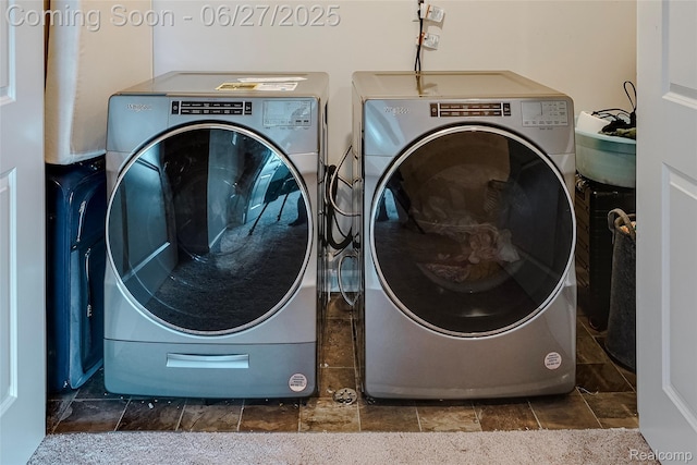 606 Angus Ln, Saline, MI 48176 - laundry room with washing machine and dryer and stone tile floors
