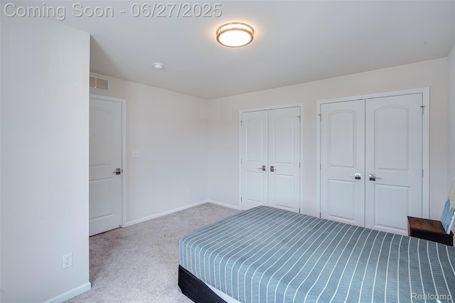 606 Angus Ln, Saline, MI 48176 - unfurnished bedroom featuring carpet and multiple closets