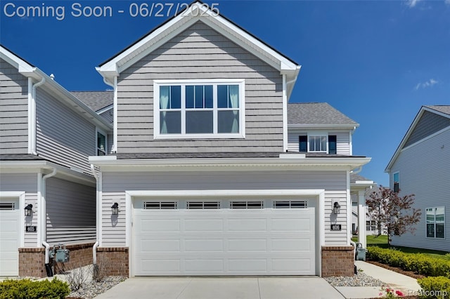 606 Angus Ln, Saline, MI 48176 - view of front of house featuring an attached garage and driveway