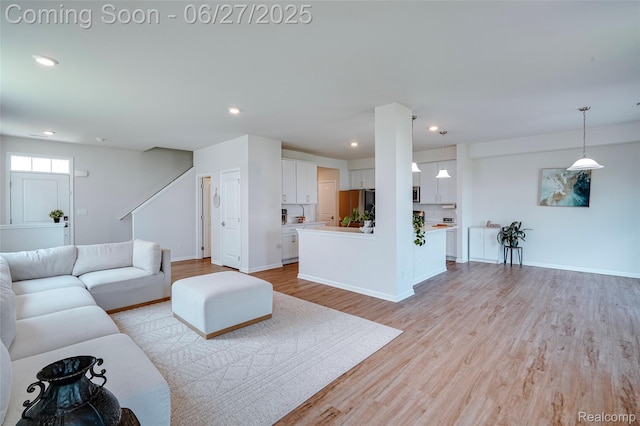 606 Angus Ln, Saline, MI 48176 - living room featuring light wood finished floors and recessed lighting