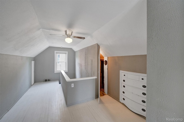 1566 Pearson St, Ferndale, MI 48220 - bonus room featuring lofted ceiling, a ceiling fan, wood finished floors, and a textured ceiling