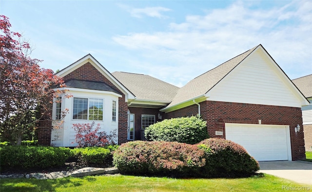 35260 Bradford Dr, New Baltimore, MI 48047 - view of front of house with brick siding, driveway, and roof with shingles