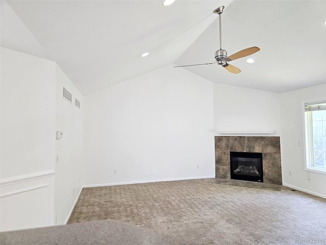 35260 Bradford Dr, New Baltimore, MI 48047 - unfurnished living room featuring lofted ceiling, carpet floors, a tile fireplace, ceiling fan, and recessed lighting