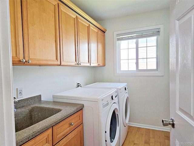 35260 Bradford Dr, New Baltimore, MI 48047 - laundry area with cabinet space, washing machine and clothes dryer, and light wood finished floors
