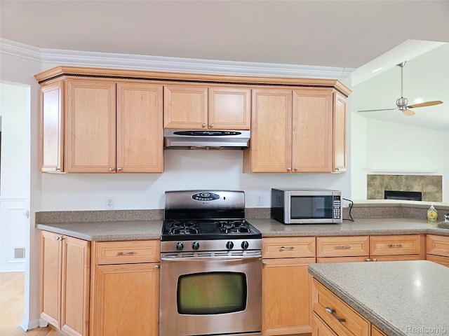 35260 Bradford Dr, New Baltimore, MI 48047 - kitchen with stainless steel appliances, under cabinet range hood, light brown cabinetry, a ceiling fan, and crown molding