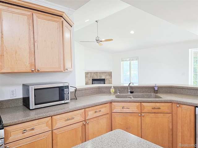 35260 Bradford Dr, New Baltimore, MI 48047 - kitchen with stainless steel microwave, light brown cabinetry, a ceiling fan, lofted ceiling, and healthy amount of natural light