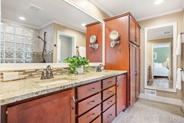 7150 Limerick Ln SW, Byron Center, MI 49315 - full bathroom featuring crown molding, double vanity, tiled shower, connected bathroom, and tasteful backsplash