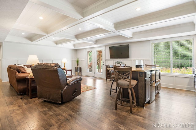 7150 Limerick Ln SW, Byron Center, MI 49315 - living area with beam ceiling, a decorative wall, dark wood-style flooring, ornamental molding, and coffered ceiling