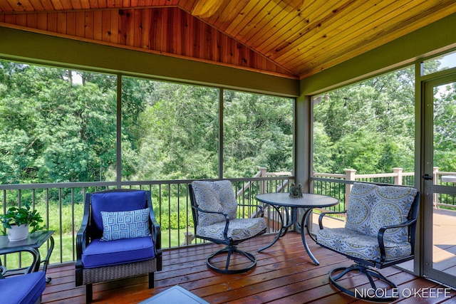 7150 Limerick Ln SW, Byron Center, MI 49315 - sunroom / solarium with vaulted ceiling, outdoor dining area, and a view of trees