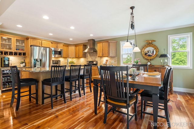 7150 Limerick Ln SW, Byron Center, MI 49315 - dining room featuring ornamental molding, hardwood / wood-style floors, plenty of natural light, and recessed lighting