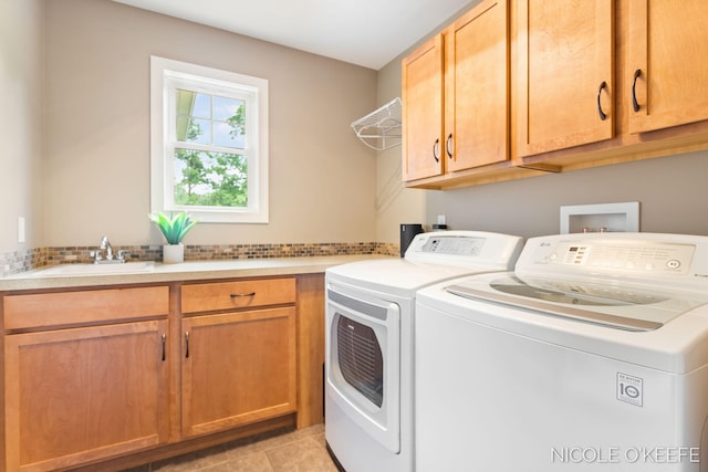 7150 Limerick Ln SW, Byron Center, MI 49315 - washroom featuring cabinet space, independent washer and dryer, and light tile patterned flooring