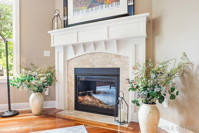 7150 Limerick Ln SW, Byron Center, MI 49315 - detailed view of a brick fireplace and wood finished floors