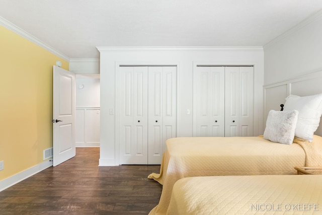 7150 Limerick Ln SW, Byron Center, MI 49315 - bedroom with two closets, ornamental molding, and dark wood finished floors
