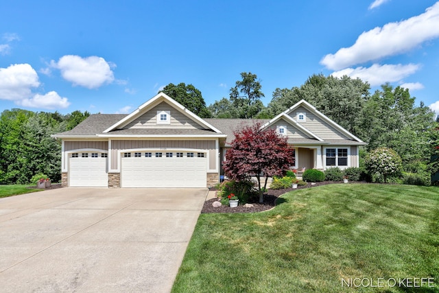 7150 Limerick Ln SW, Byron Center, MI 49315 - craftsman house featuring stone siding, a garage, concrete driveway, a front yard, and a shingled roof