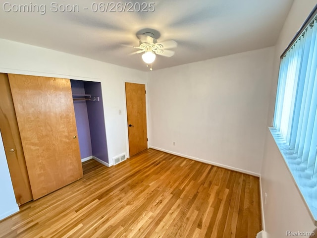 11522 Gerald Dr, Warren, MI 48093 - unfurnished bedroom with wood finished floors, a closet, and a ceiling fan