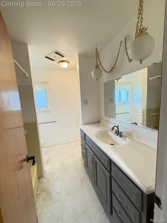 11522 Gerald Dr, Warren, MI 48093 - full bath featuring vanity, marble finish flooring, and shower / bathtub combination