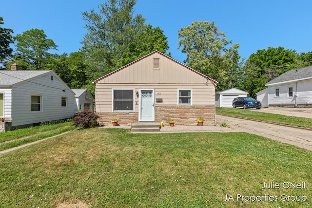 1035 Eastern Ave NE, Grand Rapids, MI 49503 - view of front of house with stone siding and a front yard