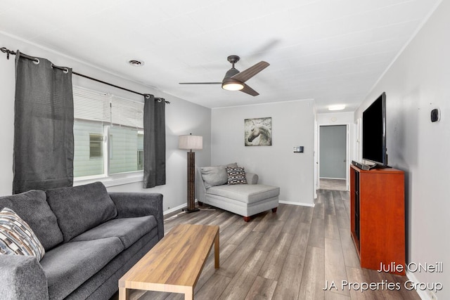 1035 Eastern Ave NE, Grand Rapids, MI 49503 - living area featuring a ceiling fan and wood finished floors