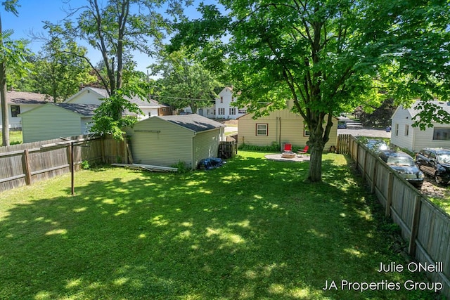 1035 Eastern Ave NE, Grand Rapids, MI 49503 - fenced backyard with a storage unit and a residential view