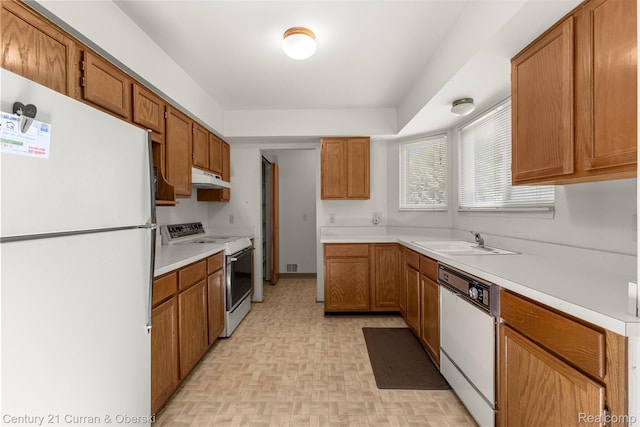 31450 Orchard Brook Ct Unit 8, Farmington Hills, MI 48336 - kitchen featuring white appliances, under cabinet range hood, light countertops, and brown cabinetry