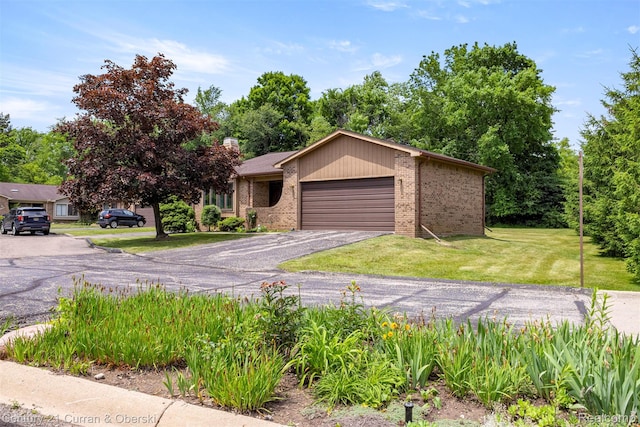 31450 Orchard Brook Ct Unit 8, Farmington Hills, MI 48336 - view of front of house featuring brick siding, an attached garage, a front yard, driveway, and a chimney