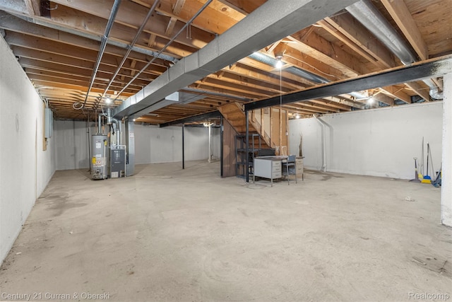 31450 Orchard Brook Ct Unit 8, Farmington Hills, MI 48336 - unfinished basement featuring gas water heater, stairway, and heating unit