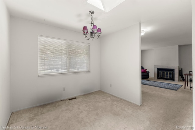 31450 Orchard Brook Ct Unit 8, Farmington Hills, MI 48336 - unfurnished dining area featuring carpet, a skylight, a fireplace, and a chandelier