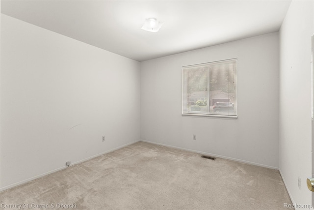 31450 Orchard Brook Ct Unit 8, Farmington Hills, MI 48336 - unfurnished room featuring light carpet and baseboards