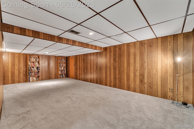 1840 Glen Iris Dr, Commerce Twp, MI 48382 - carpeted spare room with wood walls and a drop ceiling