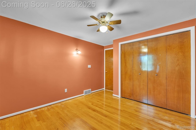 1840 Glen Iris Dr, Commerce Twp, MI 48382 - unfurnished bedroom featuring wood finished floors, a closet, and ceiling fan