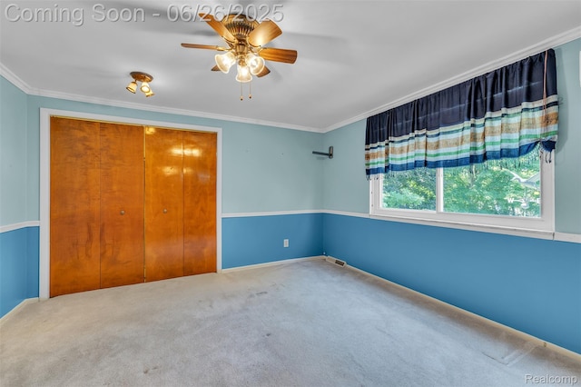 1840 Glen Iris Dr, Commerce Twp, MI 48382 - spare room featuring a ceiling fan, carpet flooring, and ornamental molding