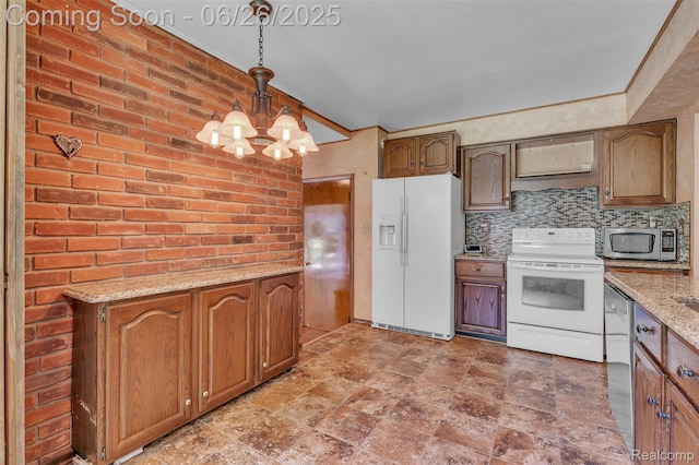 1840 Glen Iris Dr, Commerce Twp, MI 48382 - kitchen featuring stainless steel appliances, a chandelier, pendant lighting, stone finish floors, and decorative backsplash