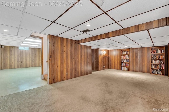 1840 Glen Iris Dr, Commerce Twp, MI 48382 - below grade area featuring wood walls, a paneled ceiling, built in shelves, and carpet flooring