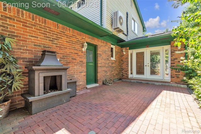 1840 Glen Iris Dr, Commerce Twp, MI 48382 - view of patio / terrace with exterior fireplace and french doors