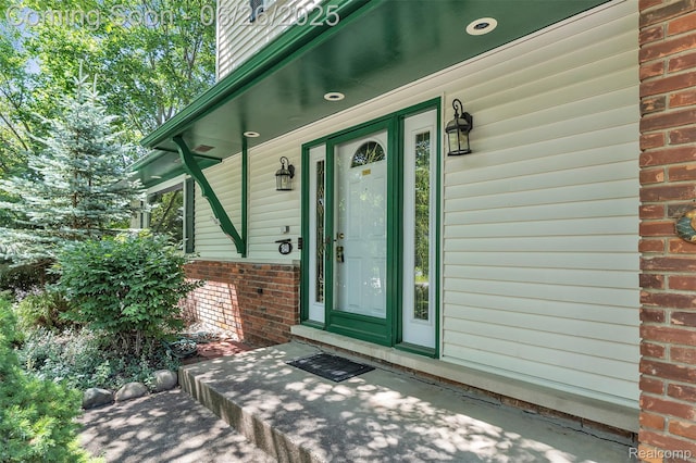 1840 Glen Iris Dr, Commerce Twp, MI 48382 - view of exterior entry with brick siding and covered porch