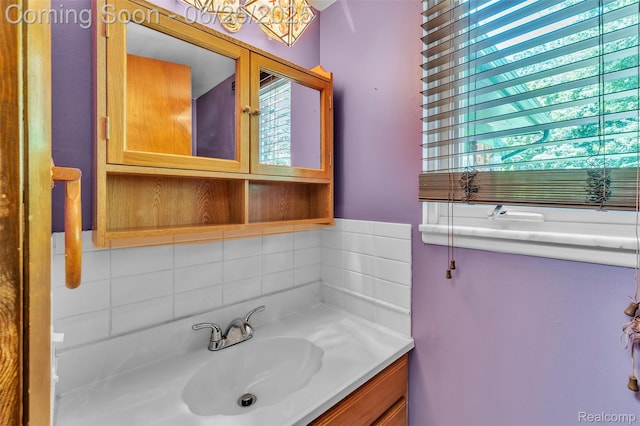 1840 Glen Iris Dr, Commerce Twp, MI 48382 - bathroom featuring vanity and decorative backsplash