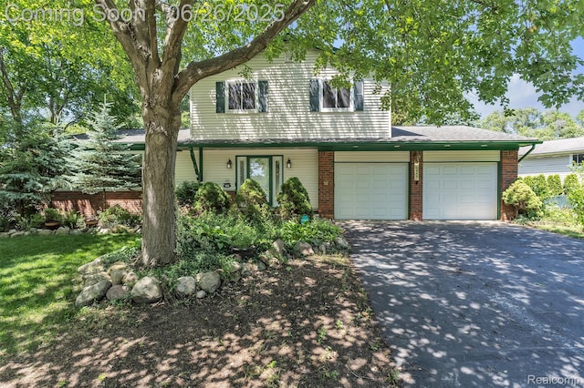 1840 Glen Iris Dr, Commerce Twp, MI 48382 - traditional-style home featuring driveway, brick siding, and a garage