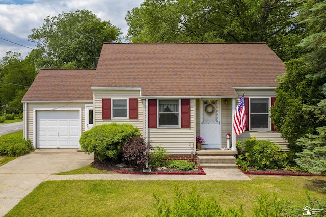 2030 W Sterns Rd, Temperance, MI 48182 - cape cod-style house with driveway, a garage, a front lawn, and roof with shingles