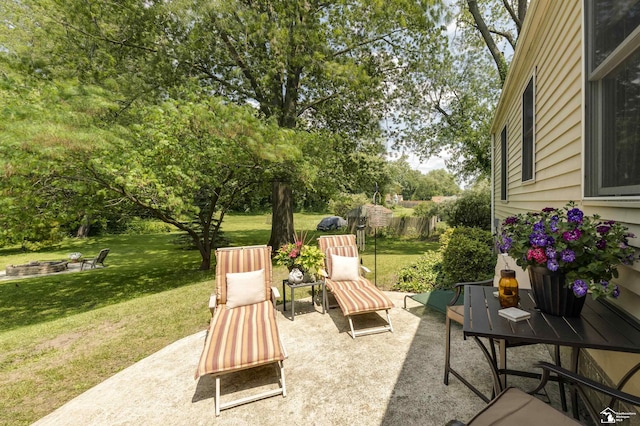 2030 W Sterns Rd, Temperance, MI 48182 - view of patio / terrace featuring an outdoor fire pit