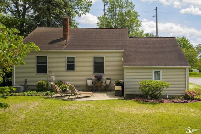 2030 W Sterns Rd, Temperance, MI 48182 - back of house featuring a chimney, a patio area, a lawn, and a shingled roof
