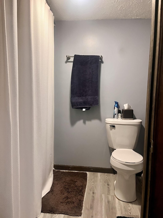 5213 Crocus Ave, Lansing, MI 48911 - bathroom with wood finished floors and a shower with curtain