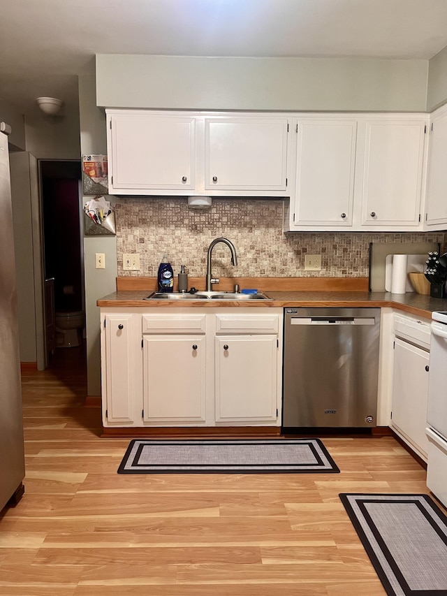 5213 Crocus Ave, Lansing, MI 48911 - kitchen with dishwasher, light wood finished floors, and white cabinetry
