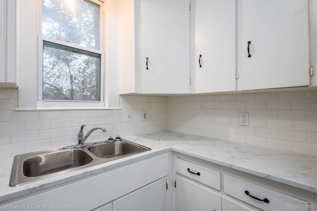 28604 Grayling Ave, Farmington Hills, MI 48336 - kitchen featuring white cabinetry and backsplash
