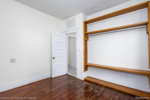 28604 Grayling Ave, Farmington Hills, MI 48336 - unfurnished bedroom featuring dark wood-type flooring and a closet