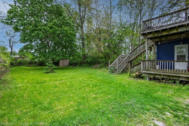 28604 Grayling Ave, Farmington Hills, MI 48336 - view of green lawn featuring stairway and a deck