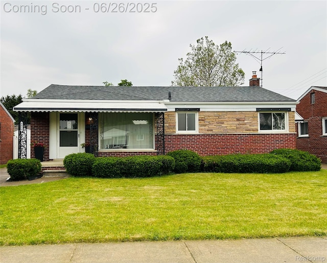 8816 Salem Ln, Redford, MI 48239 - view of front of property with a front yard, a chimney, and brick siding