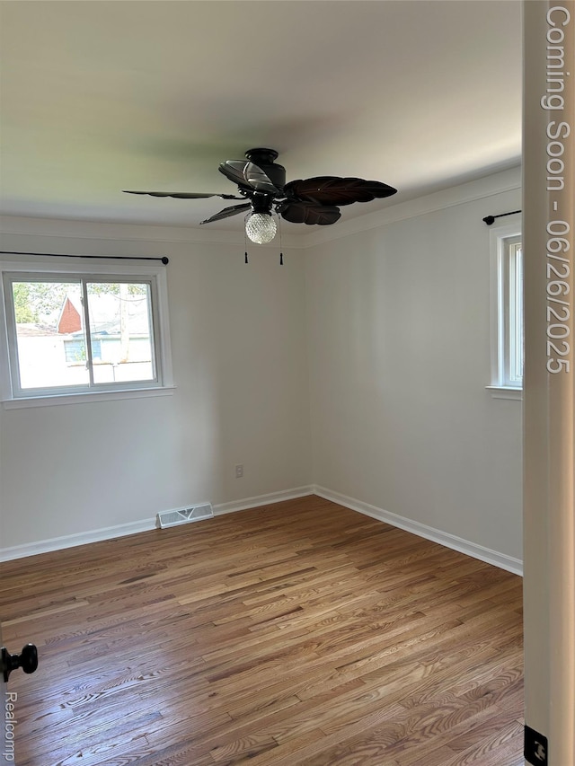 8816 Salem Ln, Redford, MI 48239 - unfurnished room with light wood-style floors, a ceiling fan, and ornamental molding