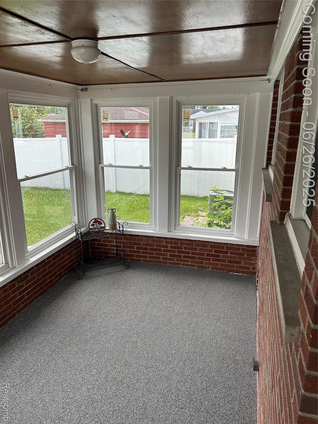 8816 Salem Ln, Redford, MI 48239 - sunroom / solarium with brick wall, carpet flooring, and healthy amount of natural light